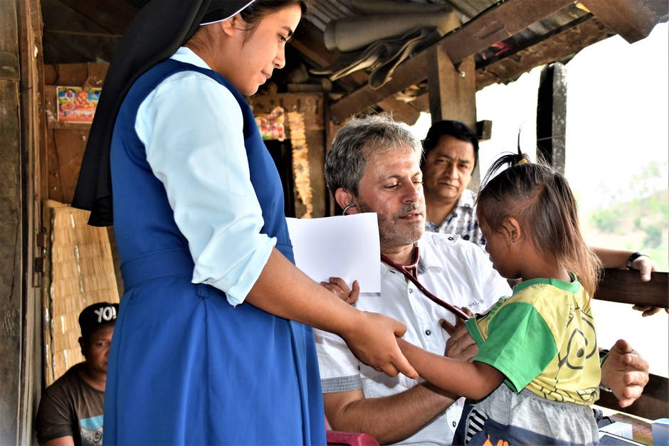 Examining of a Girl with Trisomy 21 on the Bank of the Rapti River (Sr. Tina, Fredi Bacchetto)