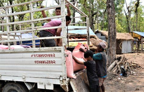 Unloading of rice sacks (Health Camp in the jungle near Cisapani)
