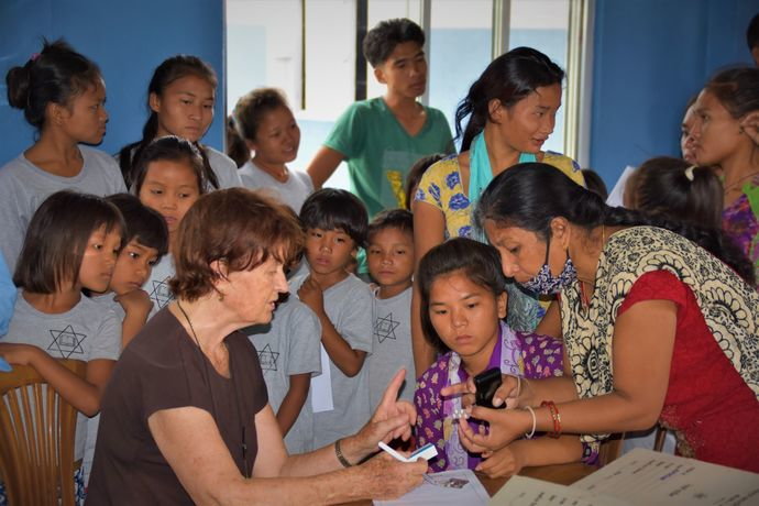 Skin Doctor Dr. Ruth Gonseth examining chepang children at Antyodaya school