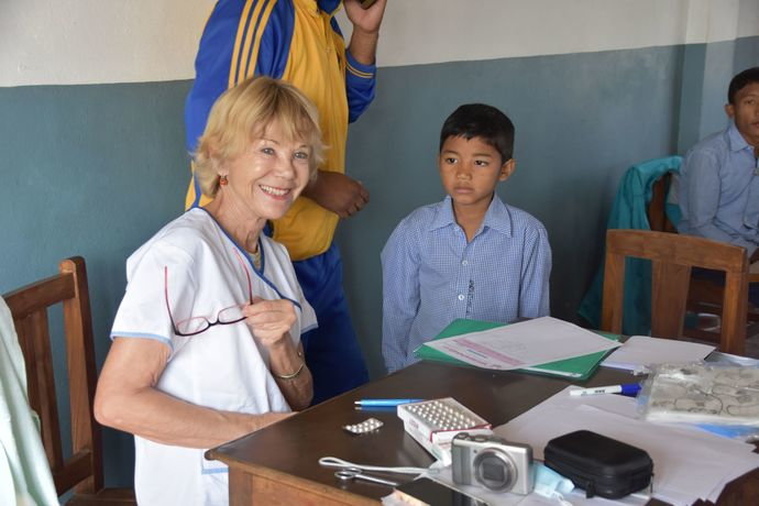 skin doctor christina emmenegger during examination at navodaya school